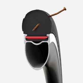 Tannus Külső Tannus Airless Shield 700x32c fekete 650g - RideShop.hu